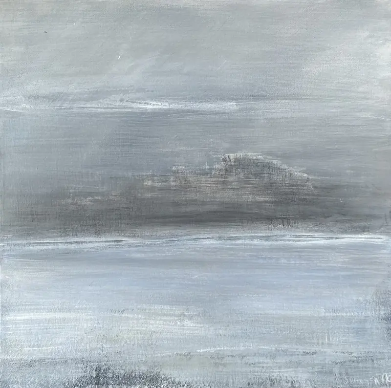 An island fading into the fog