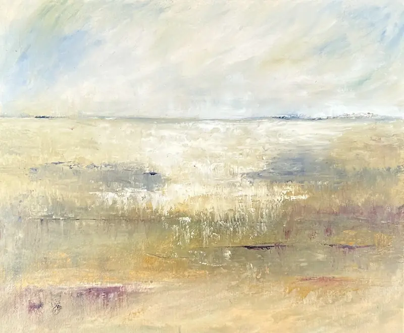 A golden meadow under a pale sky